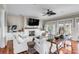 Spacious living room with fireplace, hardwood floors, and large TV at 4001 Palm Blvd, Isle of Palms, SC 29451