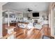 Bright living room with hardwood floors, fireplace, and built-in shelving at 4001 Palm Blvd, Isle of Palms, SC 29451