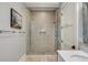 Modern shower with glass enclosure and beige tile at 4001 Palm Blvd, Isle of Palms, SC 29451