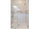 Large shower with glass enclosure and neutral tile at 4001 Palm Blvd, Isle of Palms, SC 29451