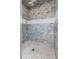 Spacious shower with gray tile and a built-in seat at 4001 Palm Blvd, Isle of Palms, SC 29451