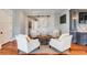 Sitting area with four armchairs and a barn door at 4001 Palm Blvd, Isle of Palms, SC 29451
