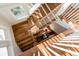 Elegant, light-filled wooden staircase with white railings at 4001 Palm Blvd, Isle of Palms, SC 29451