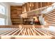 Elegant, winding staircase with wooden floors and white railings at 4001 Palm Blvd, Isle of Palms, SC 29451