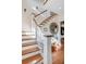 Elegant staircase with white railings and wooden steps at 4001 Palm Blvd, Isle of Palms, SC 29451