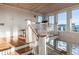 Stunning staircase with hardwood floors and white shiplap walls at 4001 Palm Blvd, Isle of Palms, SC 29451