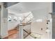 Open staircase with white railings and hardwood floors at 4001 Palm Blvd, Isle of Palms, SC 29451