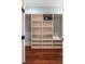 Large walk-in closet with built-in shelves and a safe at 4001 Palm Blvd, Isle of Palms, SC 29451