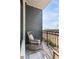 Relaxing balcony with rocking chair and city views at 5 Gadsdenboro St # 410, Charleston, SC 29401
