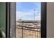 Private balcony overlooking a parking lot and distant city views at 5 Gadsdenboro St # 410, Charleston, SC 29401