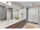 Elegant bathroom with double vanity, quartz countertop, and a walk-in shower at 5 Gadsdenboro St # 410, Charleston, SC 29401