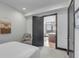 Bright bedroom with a view of the kitchen and city skyline at 5 Gadsdenboro St # 410, Charleston, SC 29401