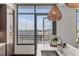 Kitchen with a stunning view from window and balcony access at 5 Gadsdenboro St # 410, Charleston, SC 29401