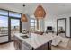 Open concept kitchen and living area with modern finishes and city views at 5 Gadsdenboro St # 410, Charleston, SC 29401