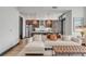 Open concept living room with kitchen and island visible at 5 Gadsdenboro St # 410, Charleston, SC 29401