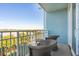 Relaxing balcony with outdoor seating and neighborhood view at 5804 Palmetto Dr # A-405/407, Isle of Palms, SC 29451