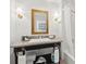 Elegant bathroom with granite vanity, large mirror, and updated fixtures at 5804 Palmetto Dr # A-405/407, Isle of Palms, SC 29451