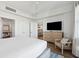 Main bedroom with a TV, dresser, and access to the kitchen and bathroom at 5804 Palmetto Dr # A-405/407, Isle of Palms, SC 29451