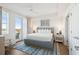 Main bedroom with a king-size bed and access to balcony at 5804 Palmetto Dr # A-405/407, Isle of Palms, SC 29451