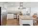Open concept kitchen with stainless steel appliances and granite countertops at 5804 Palmetto Dr # A-405/407, Isle of Palms, SC 29451