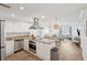 Open concept kitchen with stainless steel appliances and granite countertops at 5804 Palmetto Dr # A-405/407, Isle of Palms, SC 29451
