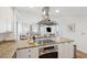 Open concept kitchen with stainless steel appliances and granite countertops at 5804 Palmetto Dr # A-405/407, Isle of Palms, SC 29451