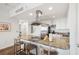 Open concept kitchen with island, granite countertops and stainless steel appliances at 5804 Palmetto Dr # A-405/407, Isle of Palms, SC 29451