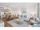 Open concept living room with kitchen and dining area views at 5804 Palmetto Dr # A-405/407, Isle of Palms, SC 29451