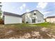House exterior with detached garage and large backyard at 7468 Northgate Dr, Hanahan, SC 29410