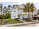 Two-story light green house with walkway and palm tree at 7468 Northgate Dr, Hanahan, SC 29410