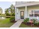 House entrance with pond view and landscaping at 7468 Northgate Dr, Hanahan, SC 29410