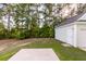 Detached garage with grassy area and a concrete pad at 7468 Northgate Dr, Hanahan, SC 29410