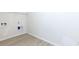 Laundry room with light walls, wood-look flooring, and hookups at 7468 Northgate Dr, Hanahan, SC 29410