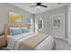 Virtually staged bedroom with a bed and window overlooking trees at 760 Myrtle Branch St, Summerville, SC 29486