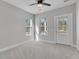 Bright bedroom with carpeted floor, ceiling fan, and multiple windows at 760 Myrtle Branch St, Summerville, SC 29486