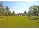 Expansive community lawn with trees and walkway at 760 Myrtle Branch St, Summerville, SC 29486
