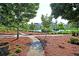 Walking path alongside pond with landscaping at 760 Myrtle Branch St, Summerville, SC 29486