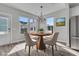 Virtually staged dining room with table, chairs, and hardwood floors at 760 Myrtle Branch St, Summerville, SC 29486