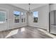 Bright dining room features hardwood floors, chandelier, and multiple windows at 760 Myrtle Branch St, Summerville, SC 29486