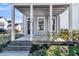 Covered front porch with brick steps and landscaping at 760 Myrtle Branch St, Summerville, SC 29486