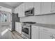 Modern kitchen with stainless steel appliances and white cabinets at 760 Myrtle Branch St, Summerville, SC 29486
