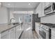 Modern kitchen with stainless steel appliances and granite countertops at 760 Myrtle Branch St, Summerville, SC 29486