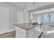 Kitchen island with granite countertop and modern pendant lighting at 760 Myrtle Branch St, Summerville, SC 29486