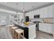 Virtually staged kitchen, featuring white cabinets and granite island at 760 Myrtle Branch St, Summerville, SC 29486