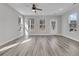 Bright living room with hardwood floors and multiple windows at 760 Myrtle Branch St, Summerville, SC 29486