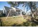 Large backyard with a swing set and privacy fence at 9504 Markley Blvd, Summerville, SC 29485
