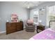Comfortable bedroom with a dresser, recliner, and ample natural light at 9504 Markley Blvd, Summerville, SC 29485