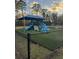 Community playground with slides, and climbing equipment covered by a shade at 9504 Markley Blvd, Summerville, SC 29485