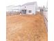 Large backyard with wooden privacy fence and screened porch at 9806 Sickle Dr, Ladson, SC 29456