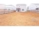 Large backyard with wooden privacy fence and screened porch at 9806 Sickle Dr, Ladson, SC 29456